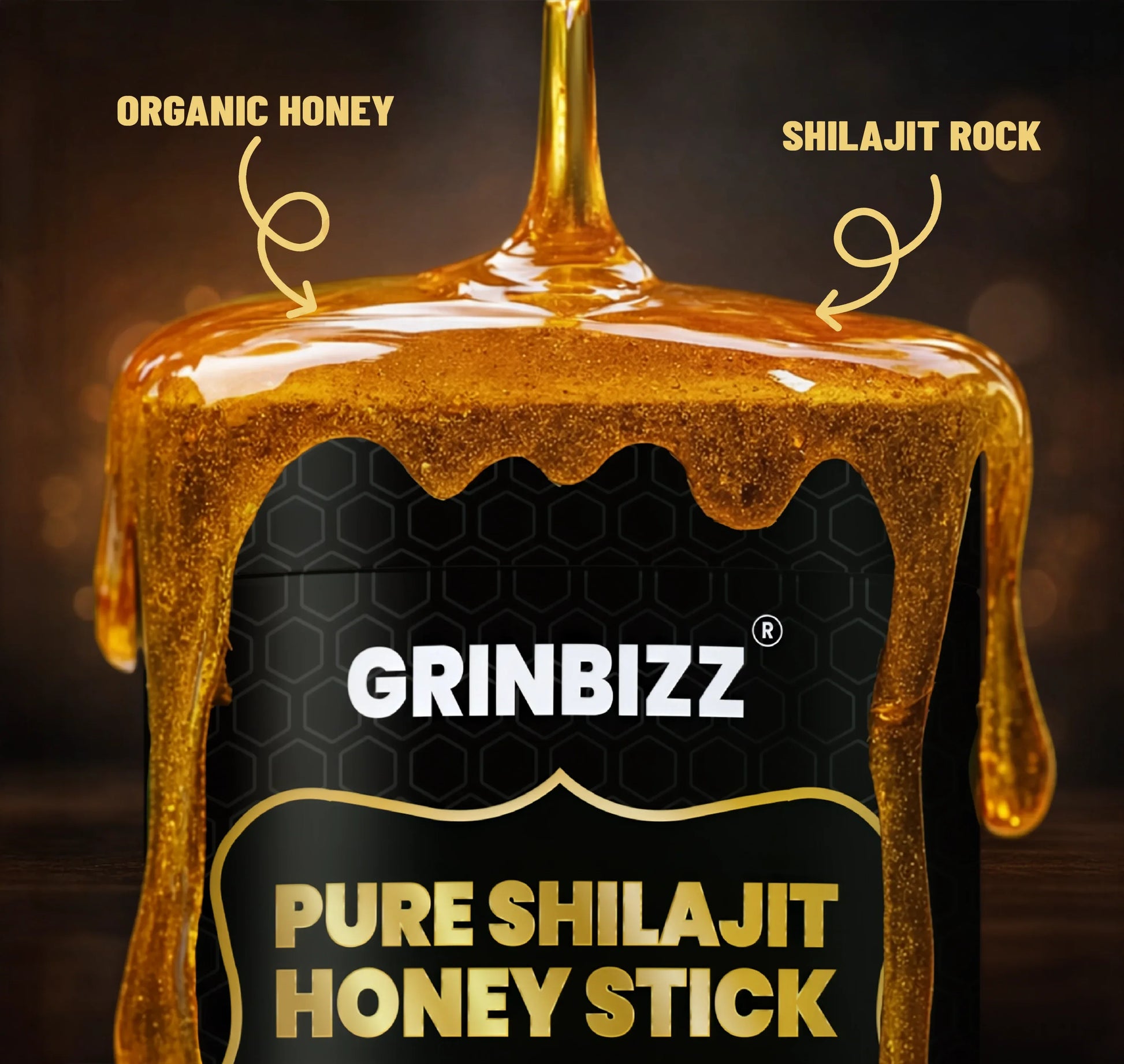 Grinbizz Pure Shilajit Honey Stick with honey dripping down, on a dark background.