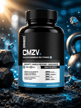 Supplement bottle labeled 'CMZV' with vitamins and minerals on a dark background with gym equipment.